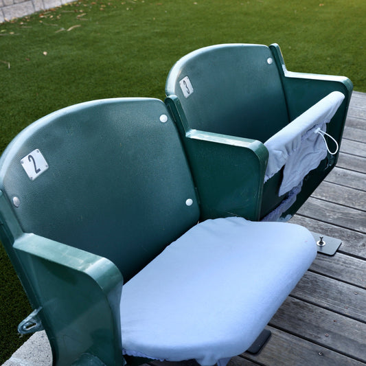grey seat cover on stadium seat