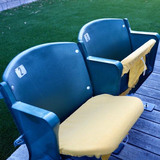 yellow seat cover on stadium seat