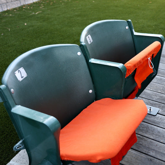 orange seat cover on stadium seats