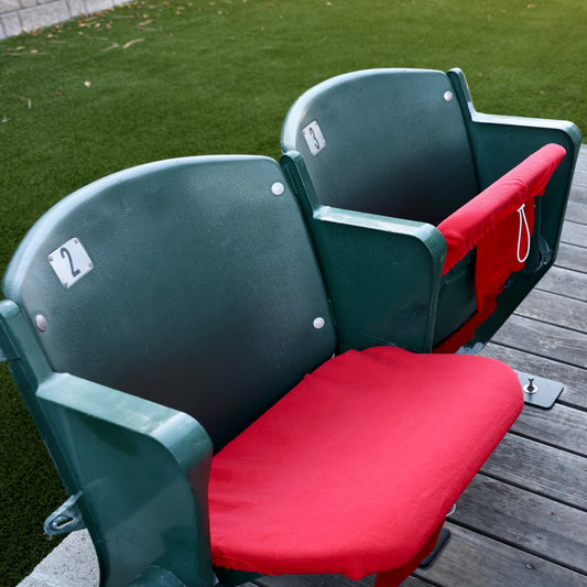 red seat cover on stadium seat