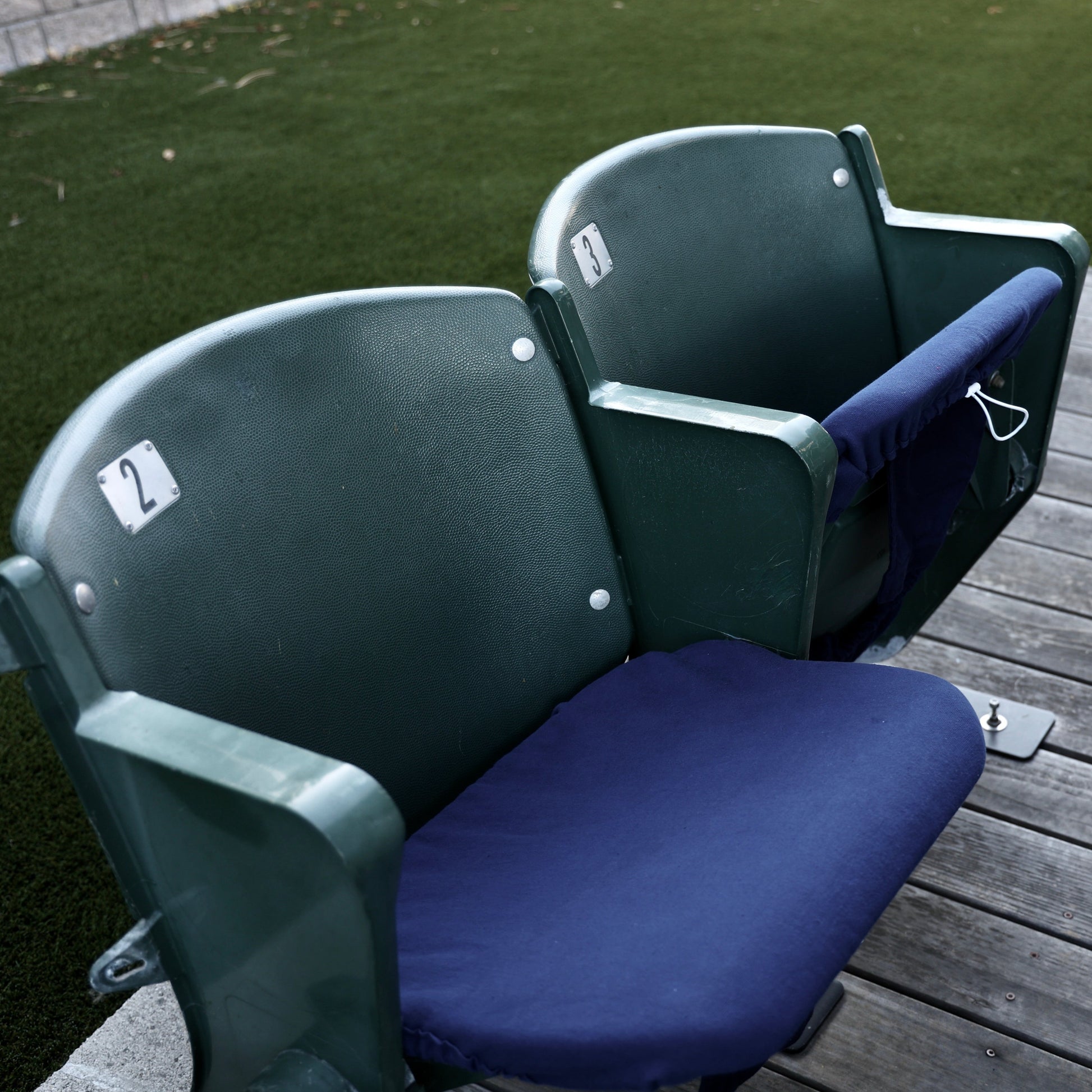 dark blue seat cover on stadium seat